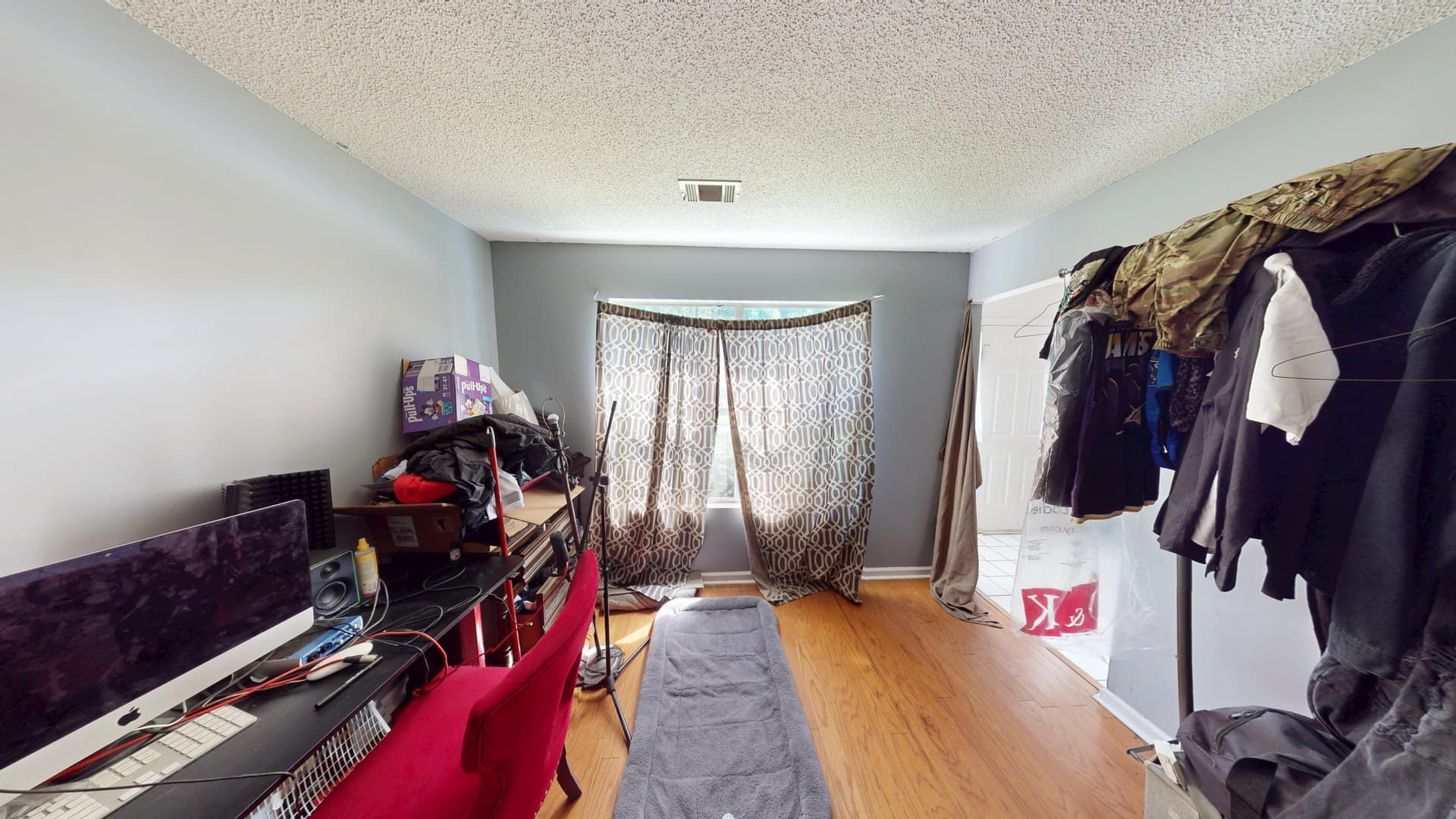 Office room with water-damaged walls and flooring before restoration