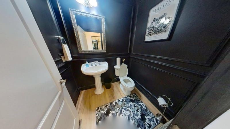Guest bathroom with new flooring after restoration