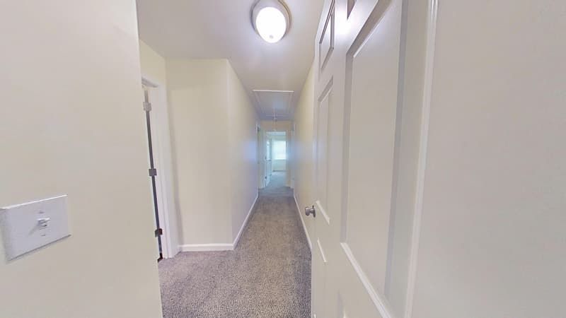 Hallway fully restored after fire damage repair with clean walls and fresh finishes