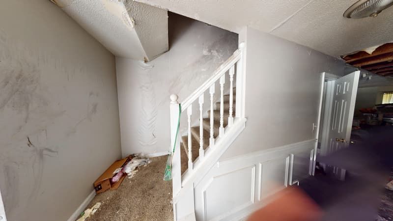 Hallway with heavy fire and smoke damage before restoration in Jonesboro, GA