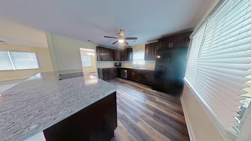 Kitchen fully restored after fire damage with clean surfaces and repaired walls