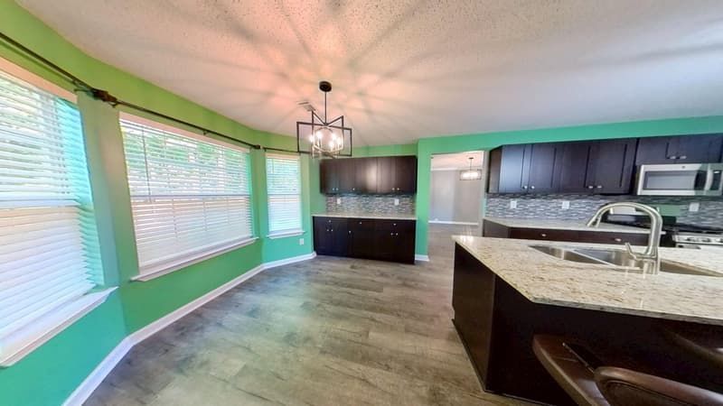 Kitchen second angle after fire restoration with new finishes installed