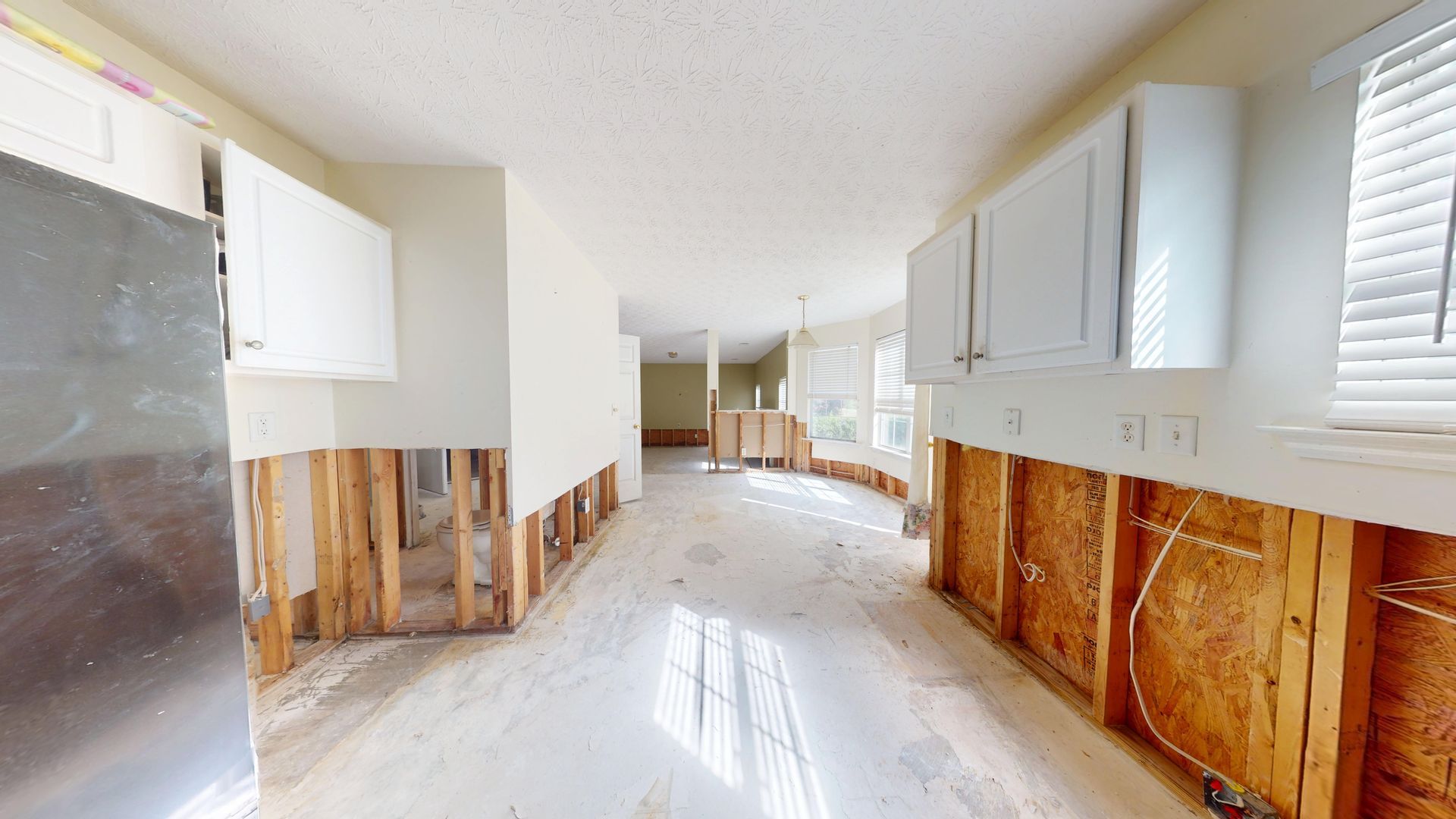 Kitchen water damage before restoration