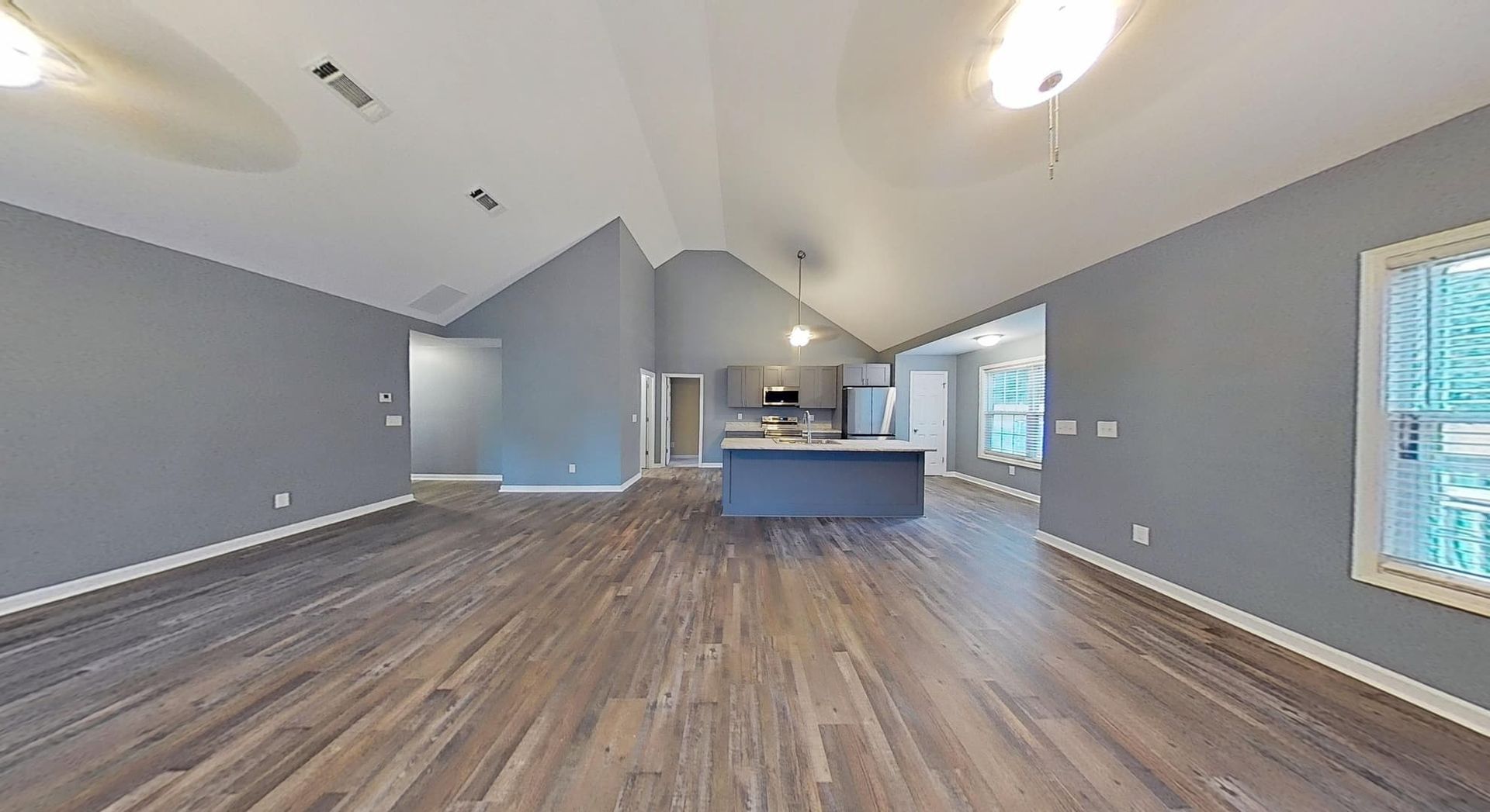 Restored living room and dining room with clean walls and new finishes after fire damage restoration