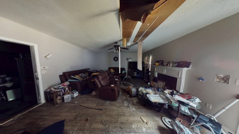 Living room with fire damage and smoke residue before restoration work began