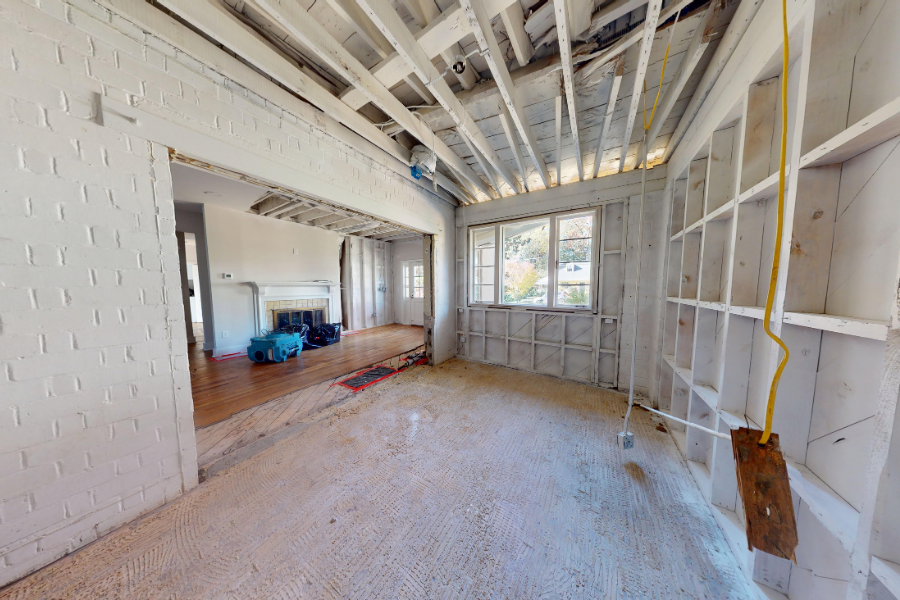 Professional restoration equipment drying out storm-damaged property