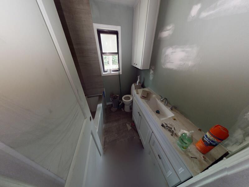 Guest bathroom fire damage before restoration