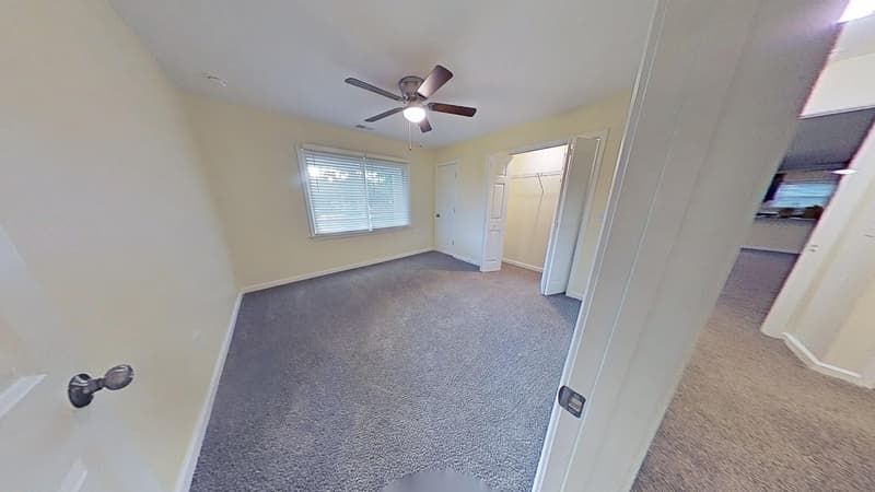 Second bedroom restored after fire damage with clean walls and fresh finishes throughout