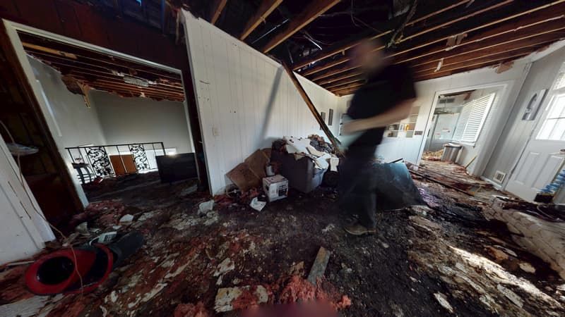 Second upstairs view before fire restoration showing extensive smoke and fire damage