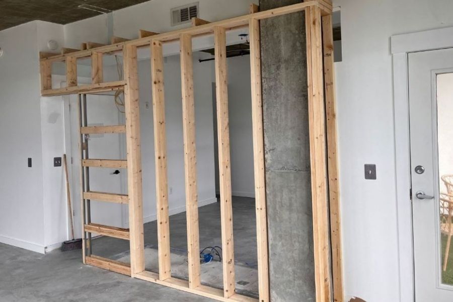 Commercial-grade air movers and dehumidifiers drying water-damaged interior after extraction