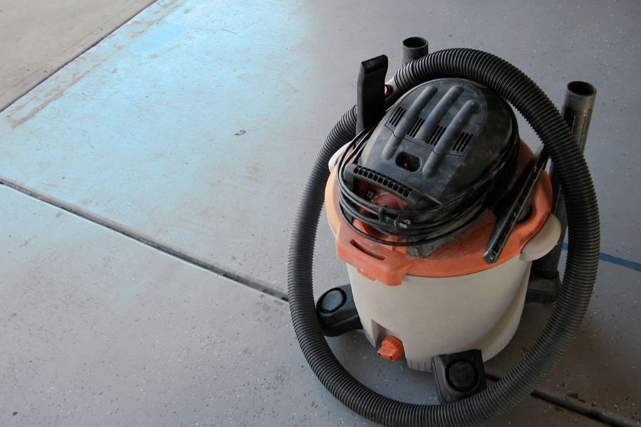 Wet vacuum being used for flood cleanup