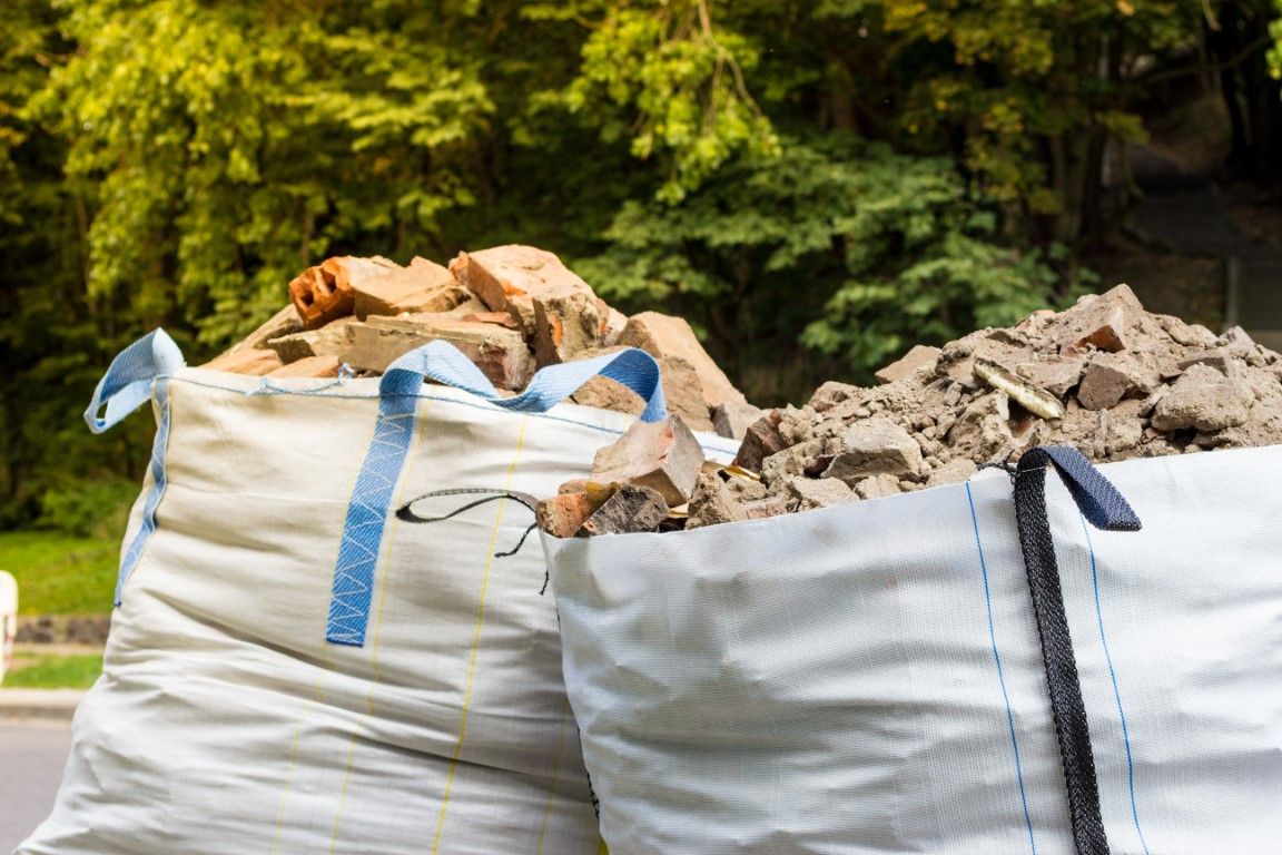 Heavy rubble bags filled with bricks and concrete on a Stirling job site