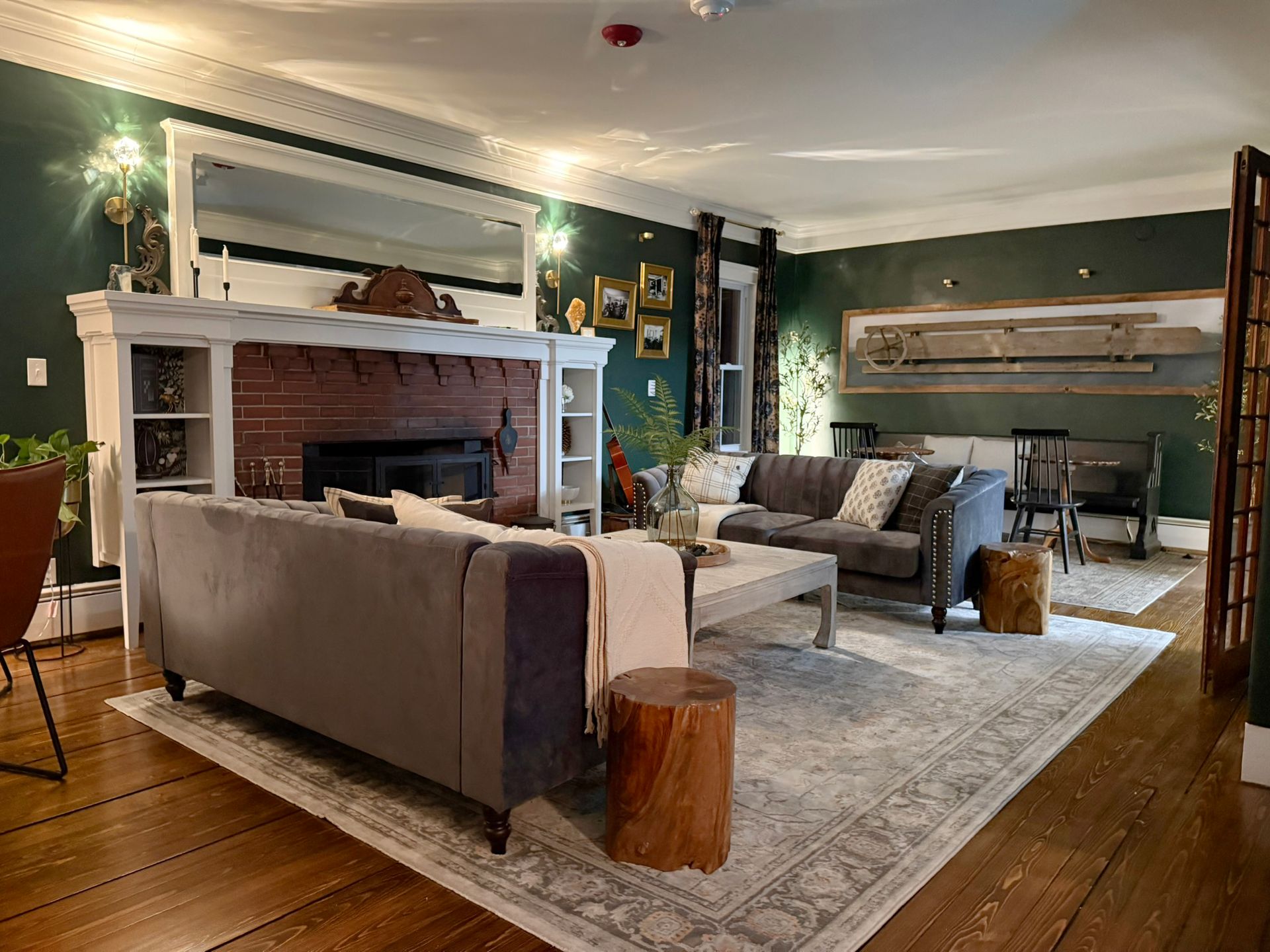A living room filled with furniture and a fireplace.