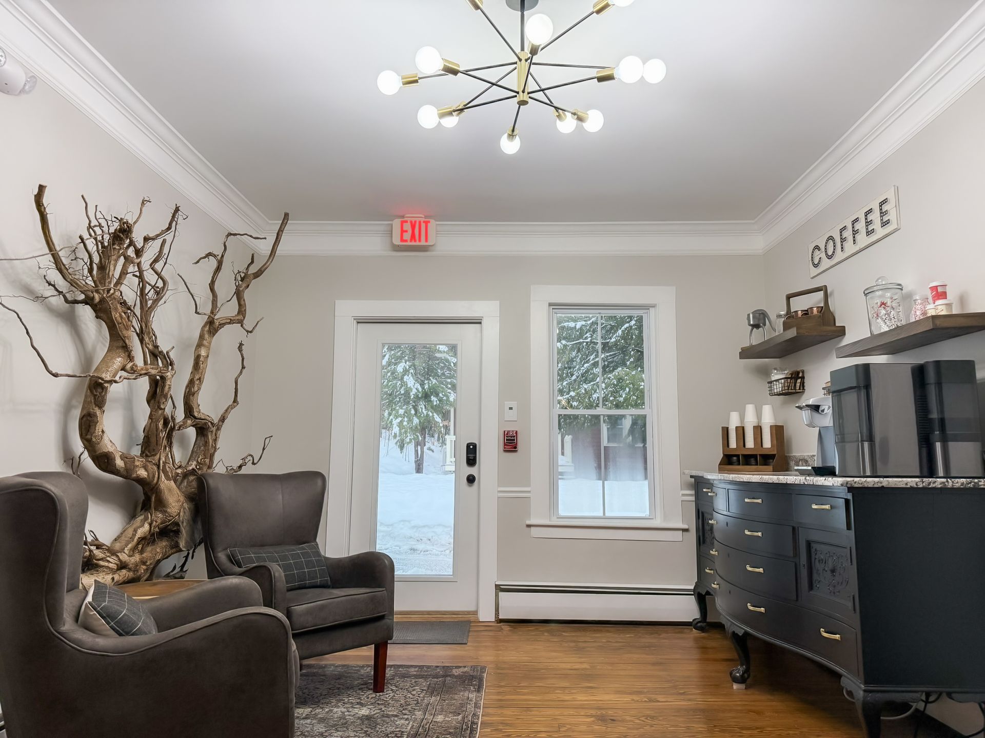 A living room with a sign that says coffee on the wall