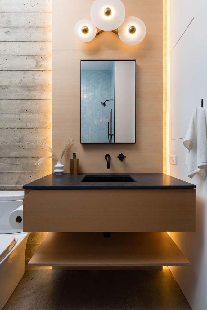 A bathroom with a sink , mirror , and bathtub.