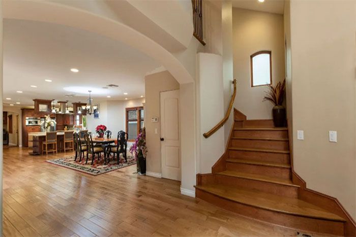 A wooden staircase leading up to the second floor of a house.