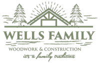Logo for Wells Family Woodwork & Construction featuring a house frame, pine trees, and text.