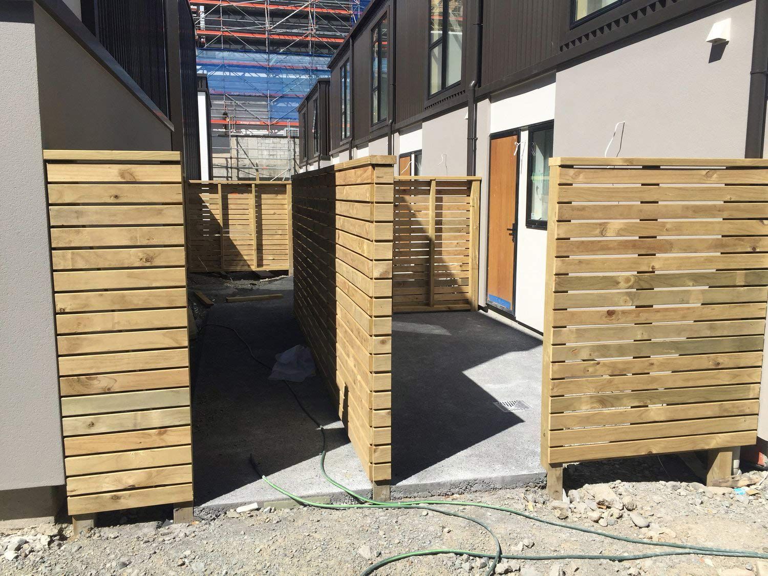 Wooden Fence in front of a Building — Wellington, NZ — Three Trees Landscaping