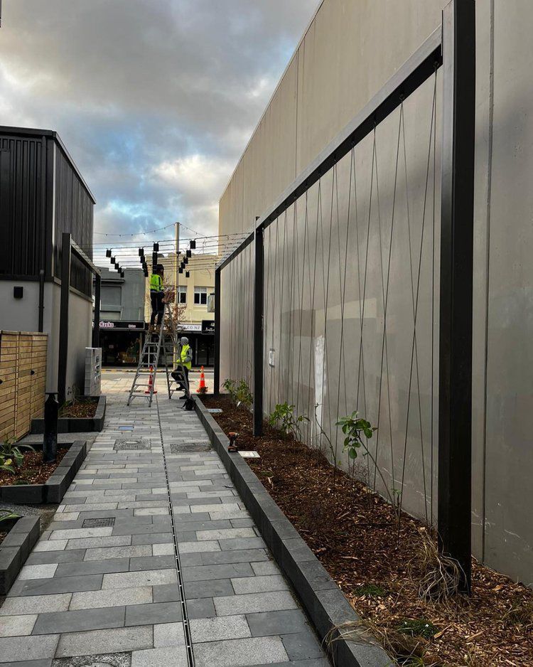 Workers Doing a Maintenance — Wellington, NZ — Three Trees Landscaping