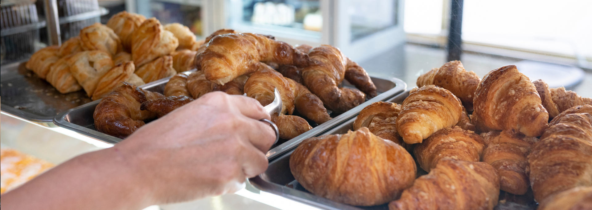 Picture of a bakery stand with croissants. Picture of a bakery stand with croissants.