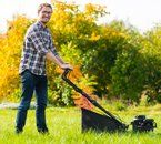 Lawn Mower Repair — Young Man Mowing the Grass in Brandon, VT