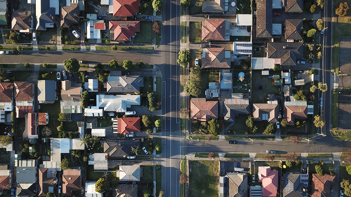 An aerial view of a residential area with lots of houses and trees.