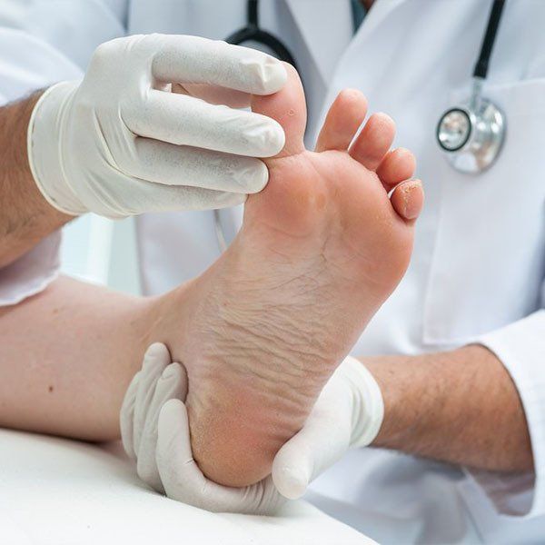 Podiatrist Checking Feet — General Podiatry in Urunga, NSW