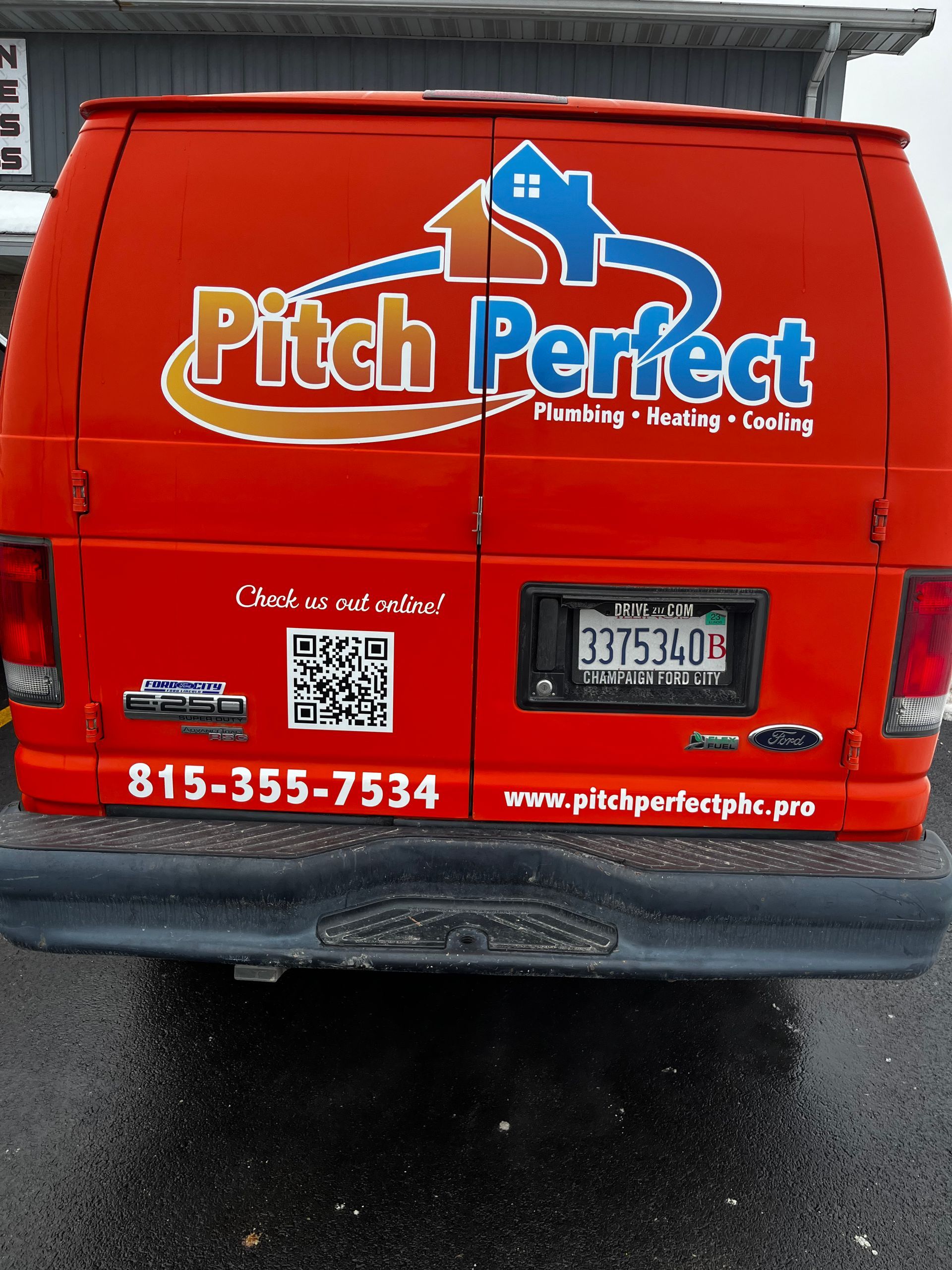 A red van with pitch perfect written on the back