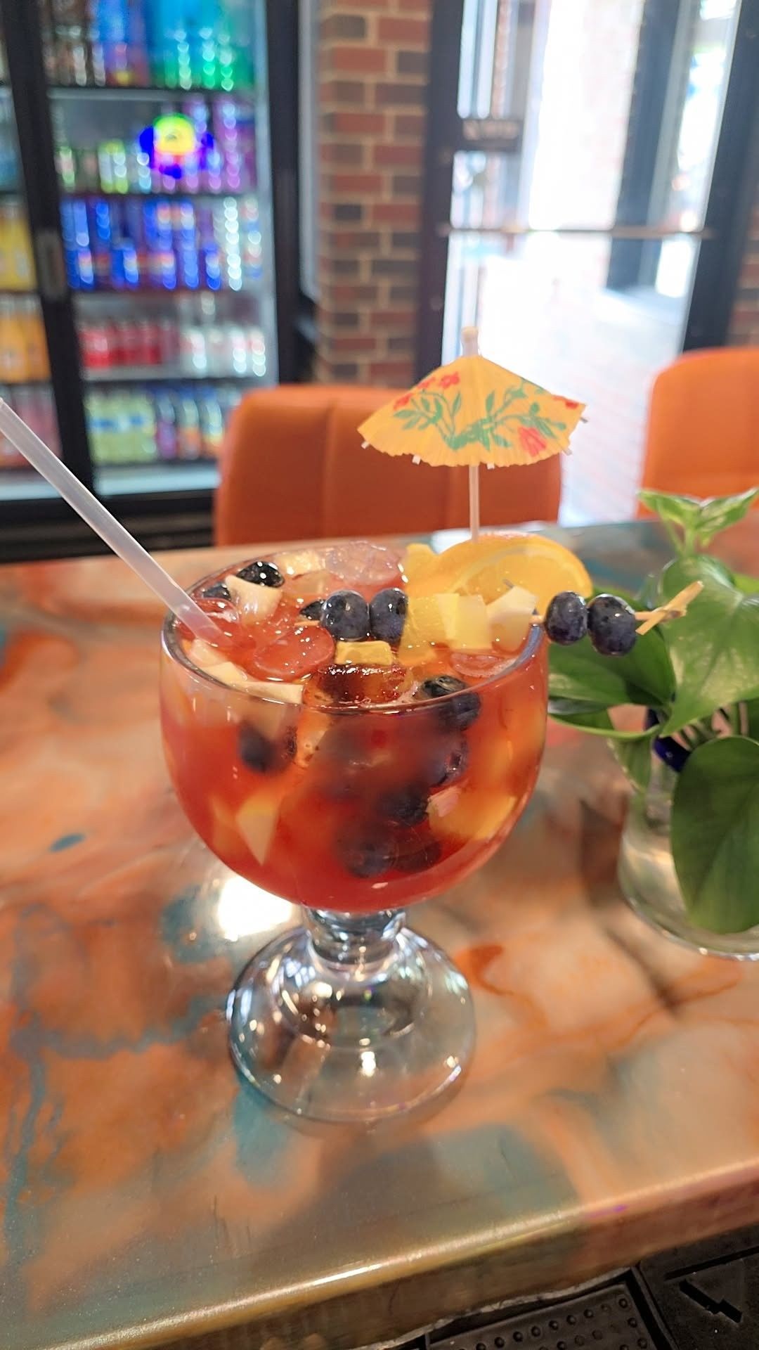 Mexican fajitas with rice, beans, and salad on a white plate; sizzling meat, shrimp, and vegetables on a skillet.