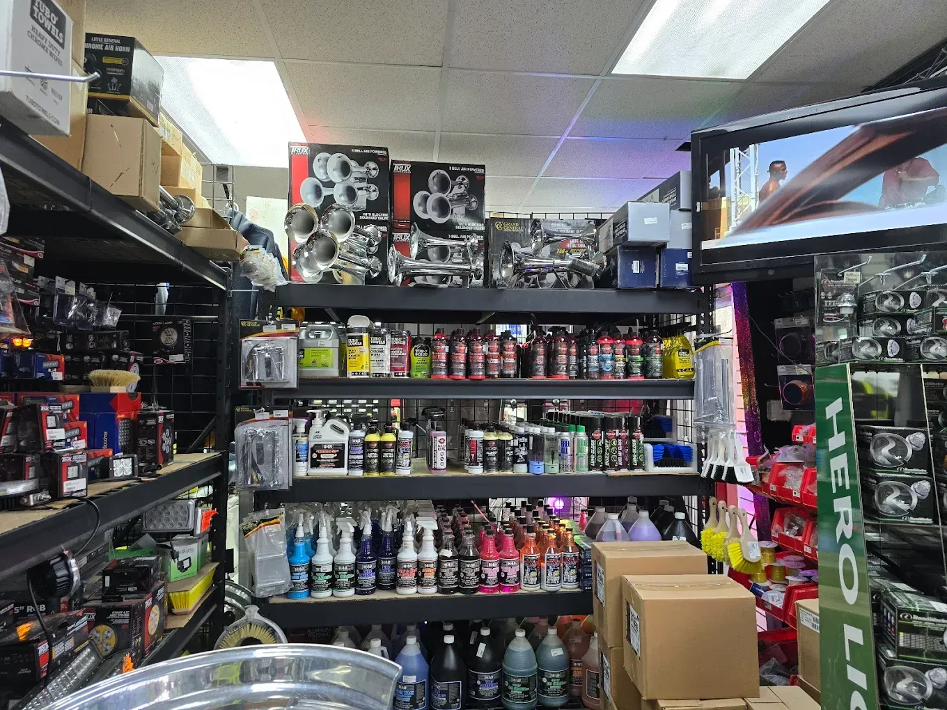 A brown semi truck is parked on the side of a road.