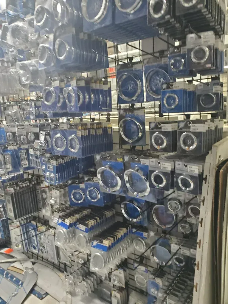 A bunch of rings are hanging on a rack in a store.