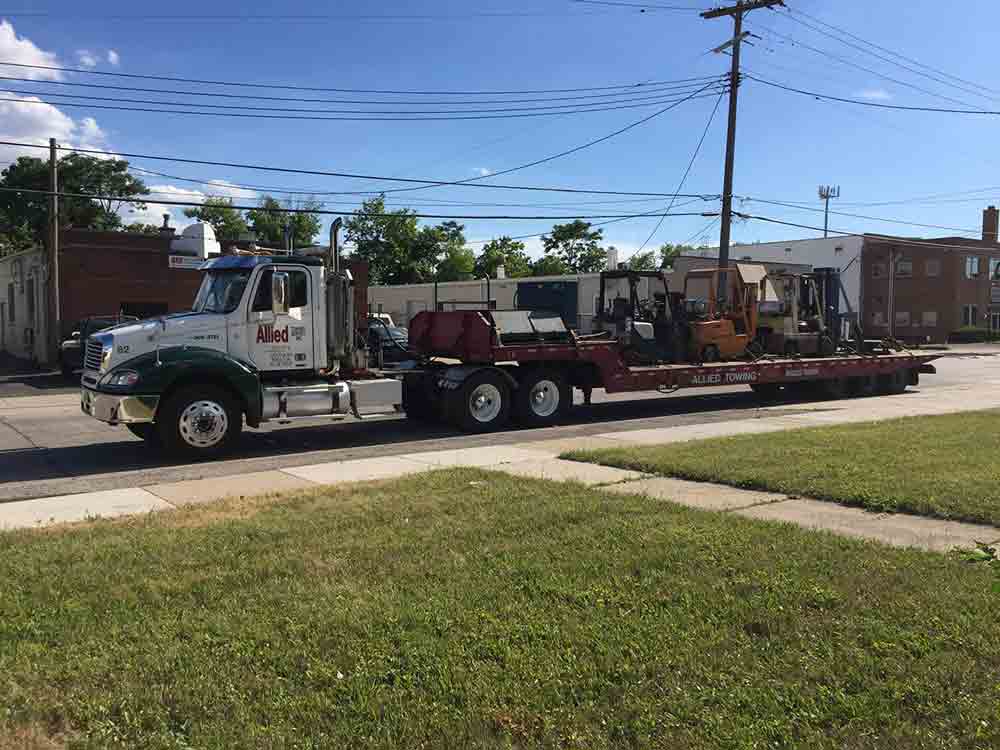 Heavy Towing Service — Towing Truck Towing a Vehicle, MI