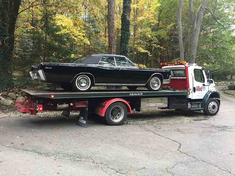 Towing Vehicle — Transporting a Black Car in Detroit, MI
