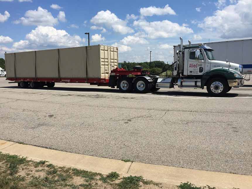Towing Truck Services — Towing Truck Transporting Goods in Detroit, MI