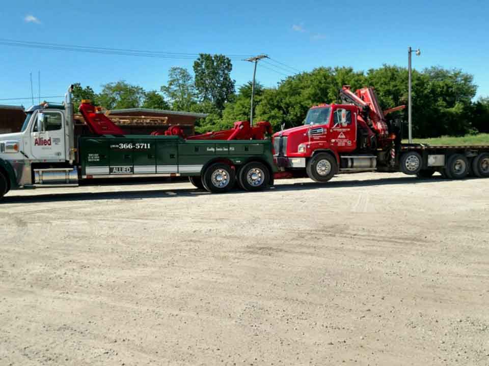 Commercial Fleet Towing — Truck Towing a Red Truck in Detroit, MI