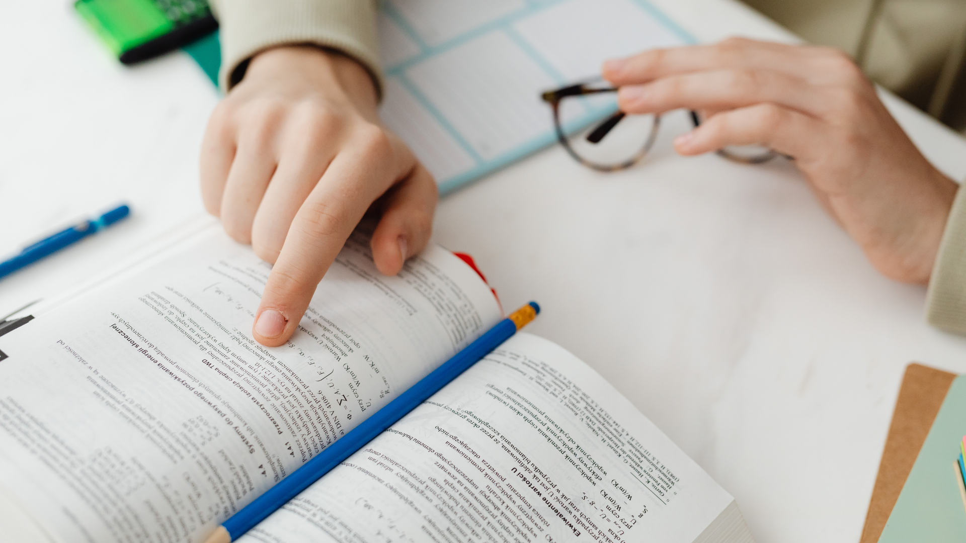 One-to-one tutoring session (student and tutor reviewing notes)