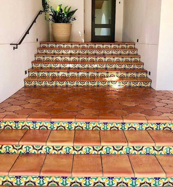 Saltillo and Talavera tile flooring steps that lead up to a front door.