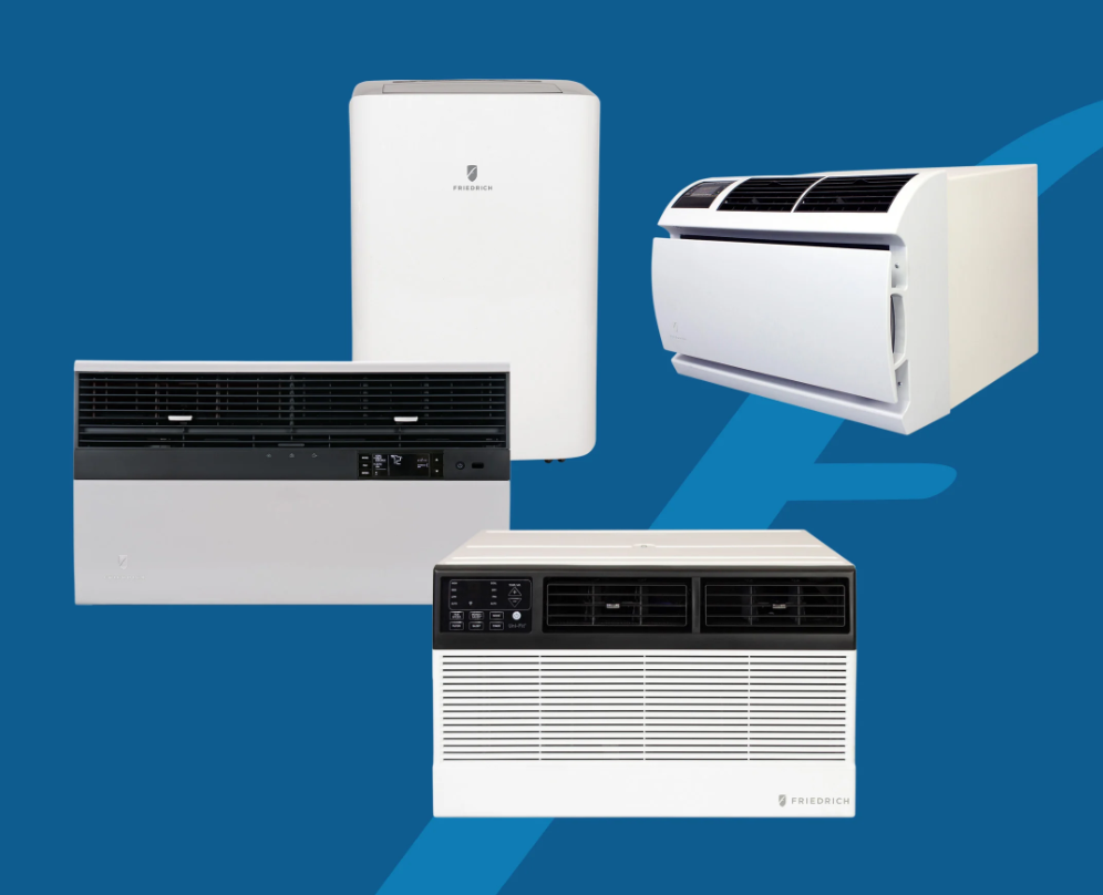 A person cleaning an air conditioner coil with a water hose outdoors on grass.