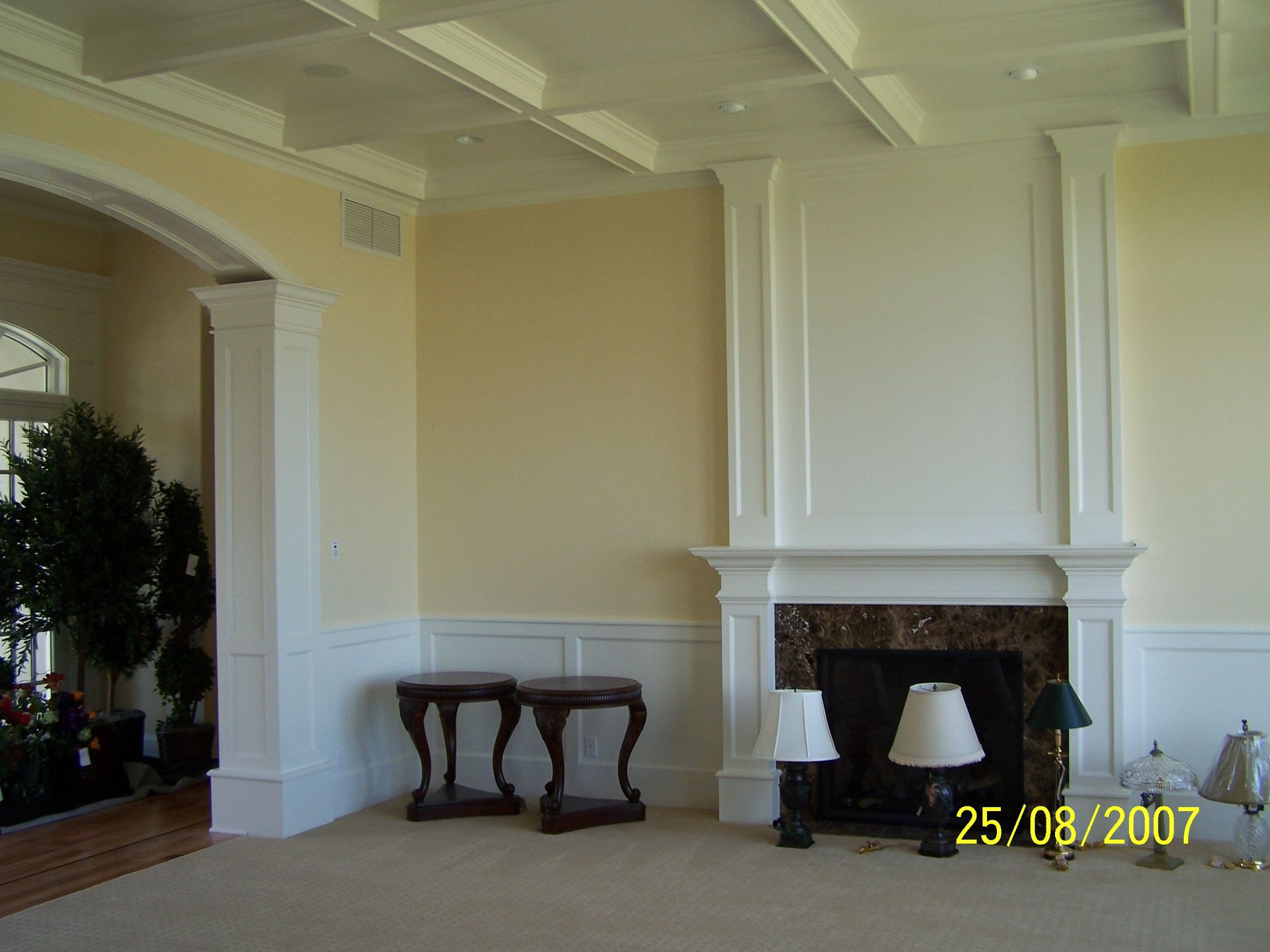 A living room with a fireplace and lamps on the 25th of august 2007