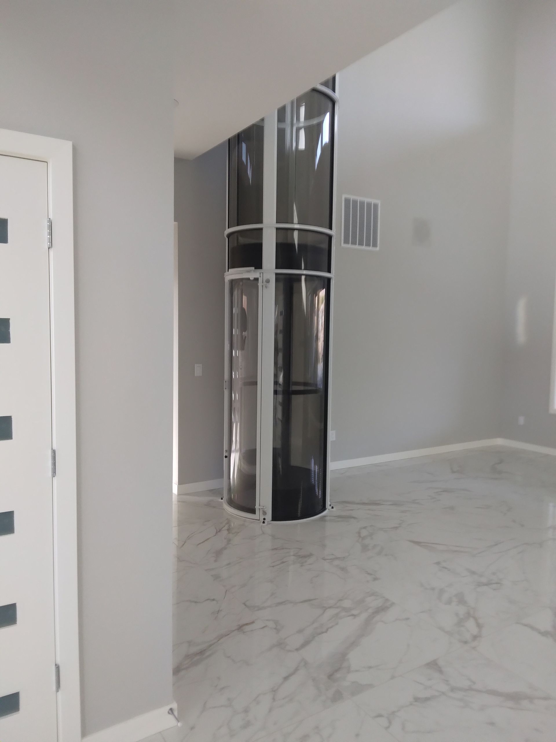 There is a elevator in the middle of the room.