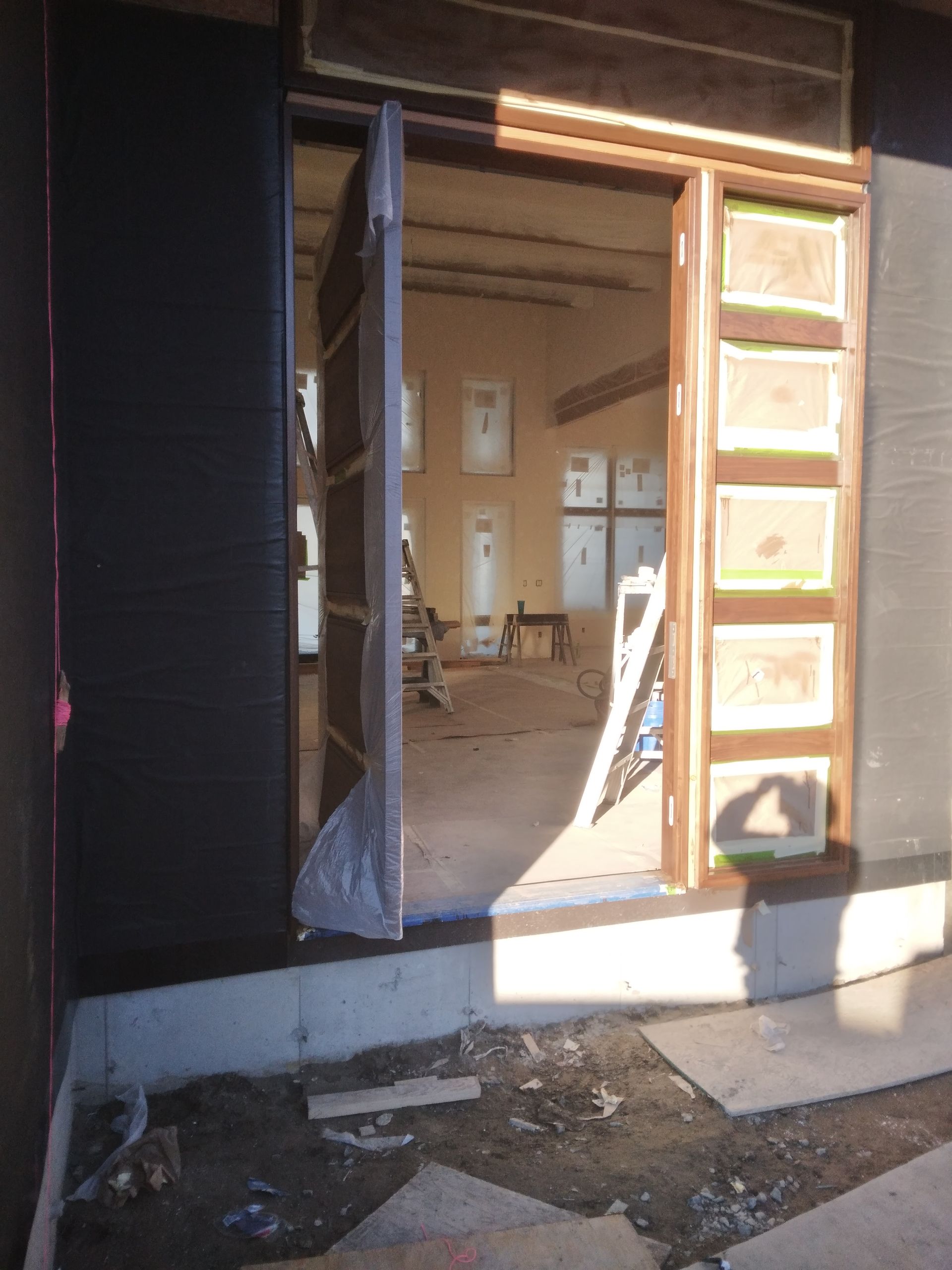 A door is open to a building under construction