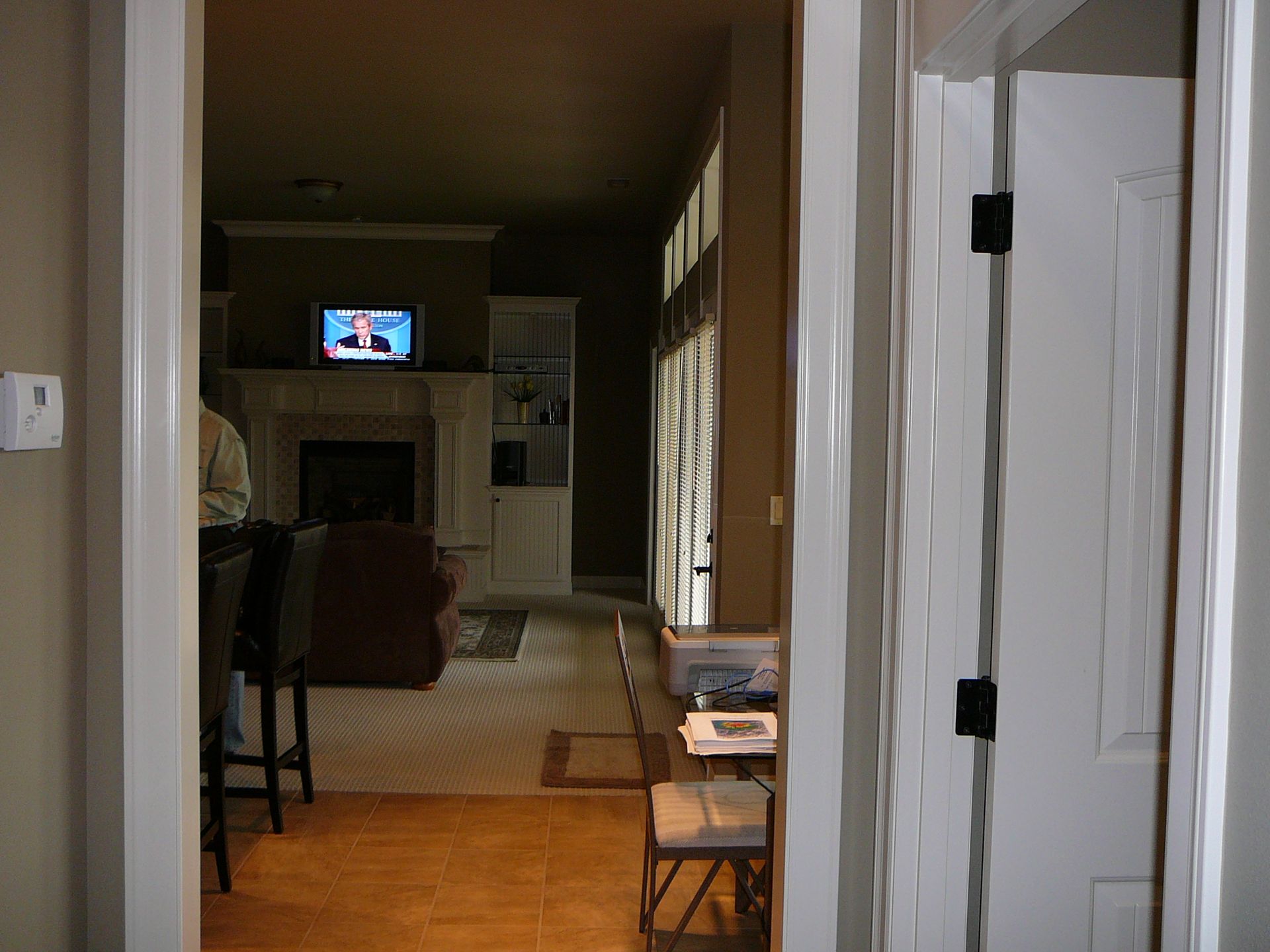 A living room with a television and a fireplace