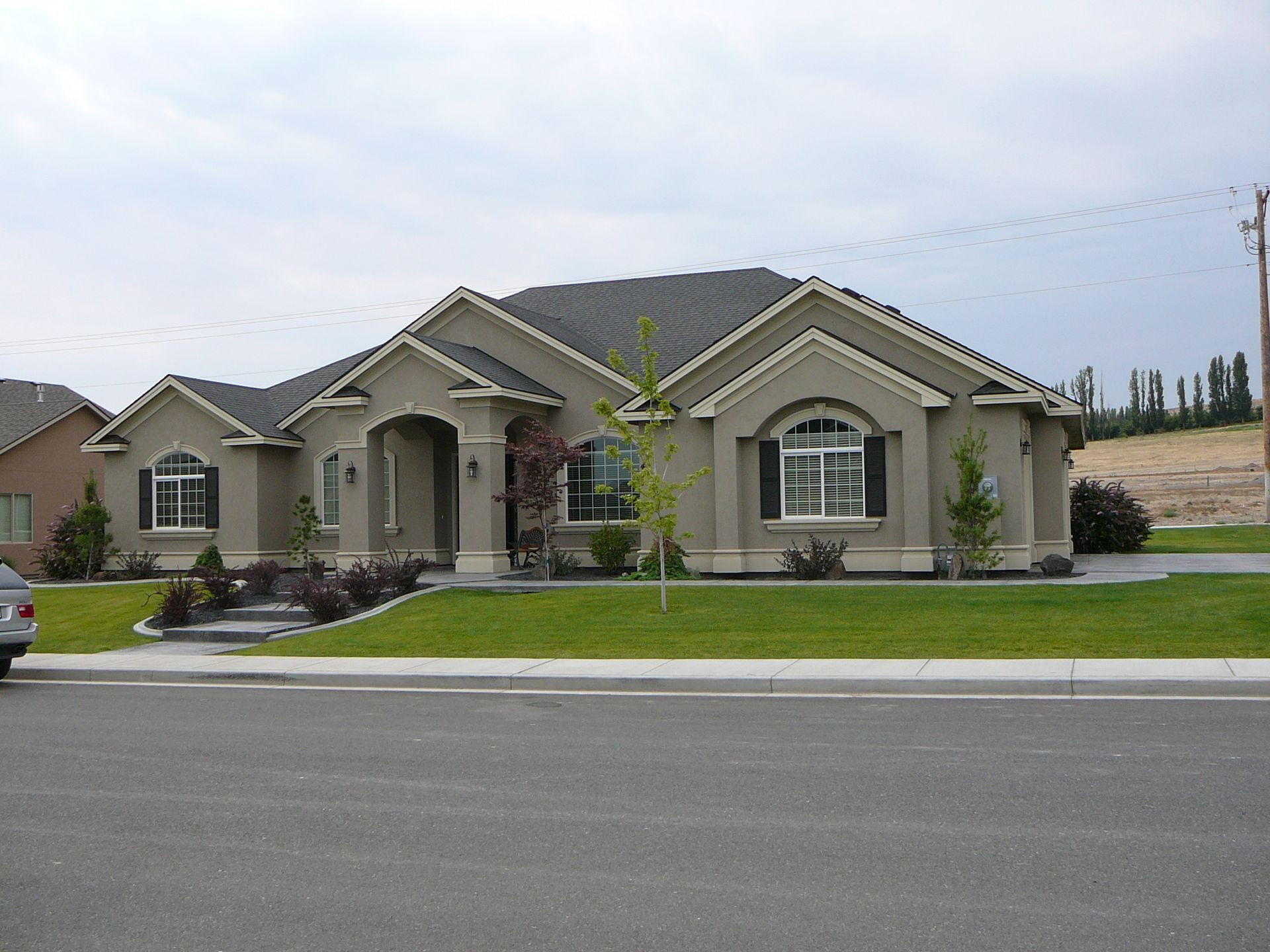 A house with a car parked in front of it