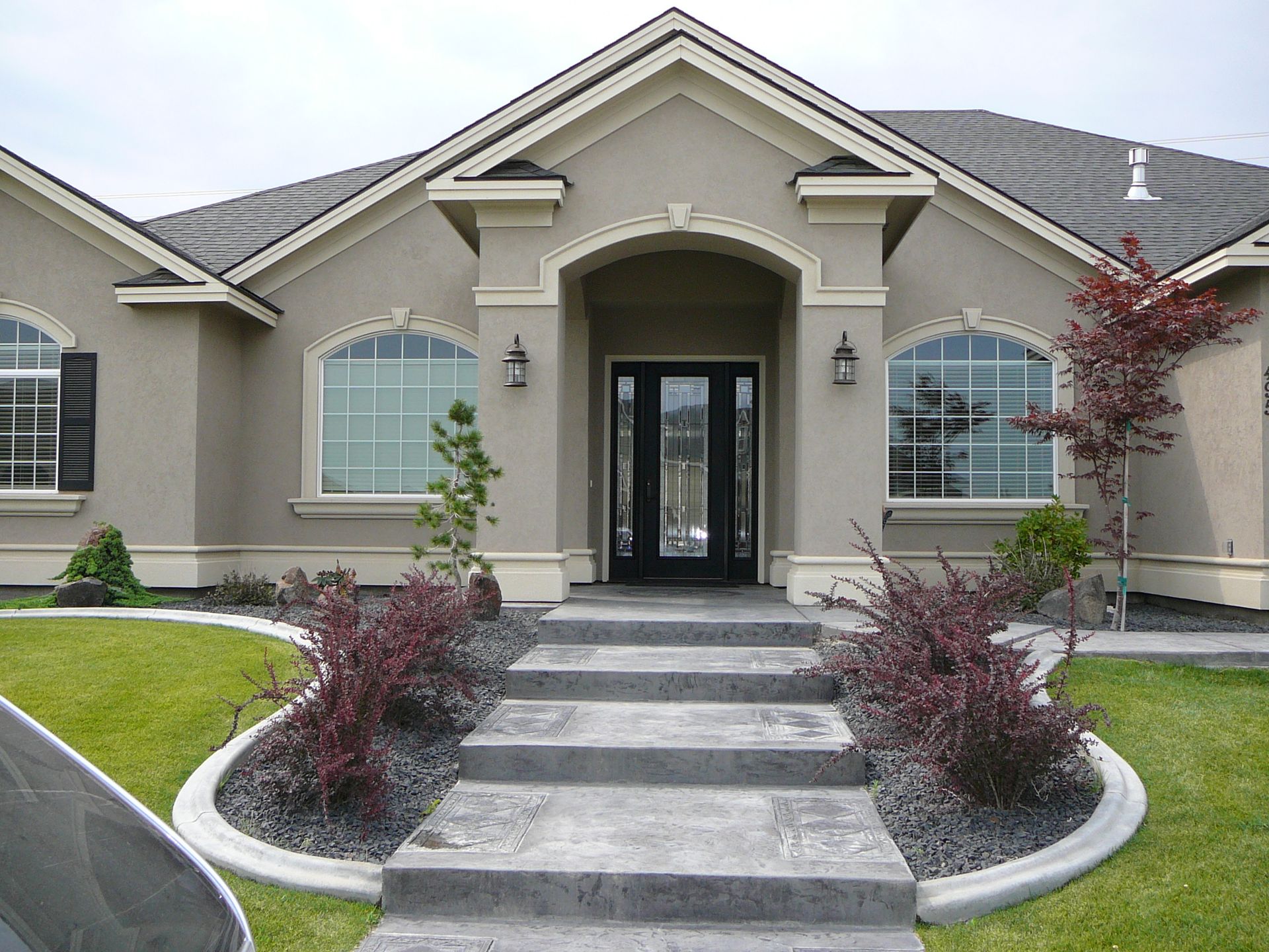 A house with stairs leading up to the front door