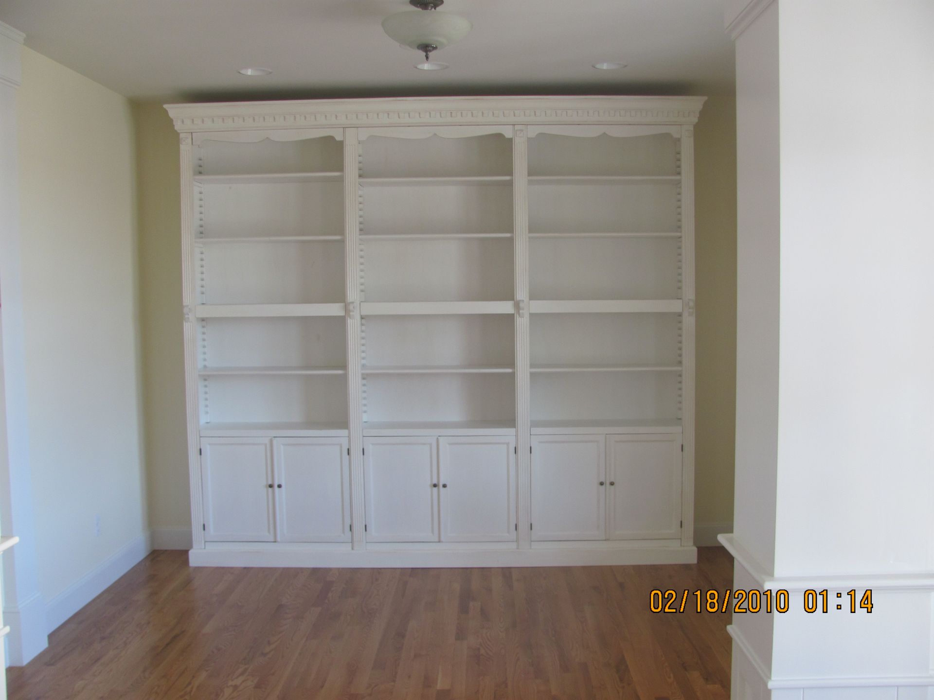 A picture of a bookcase was taken on february 18 2010