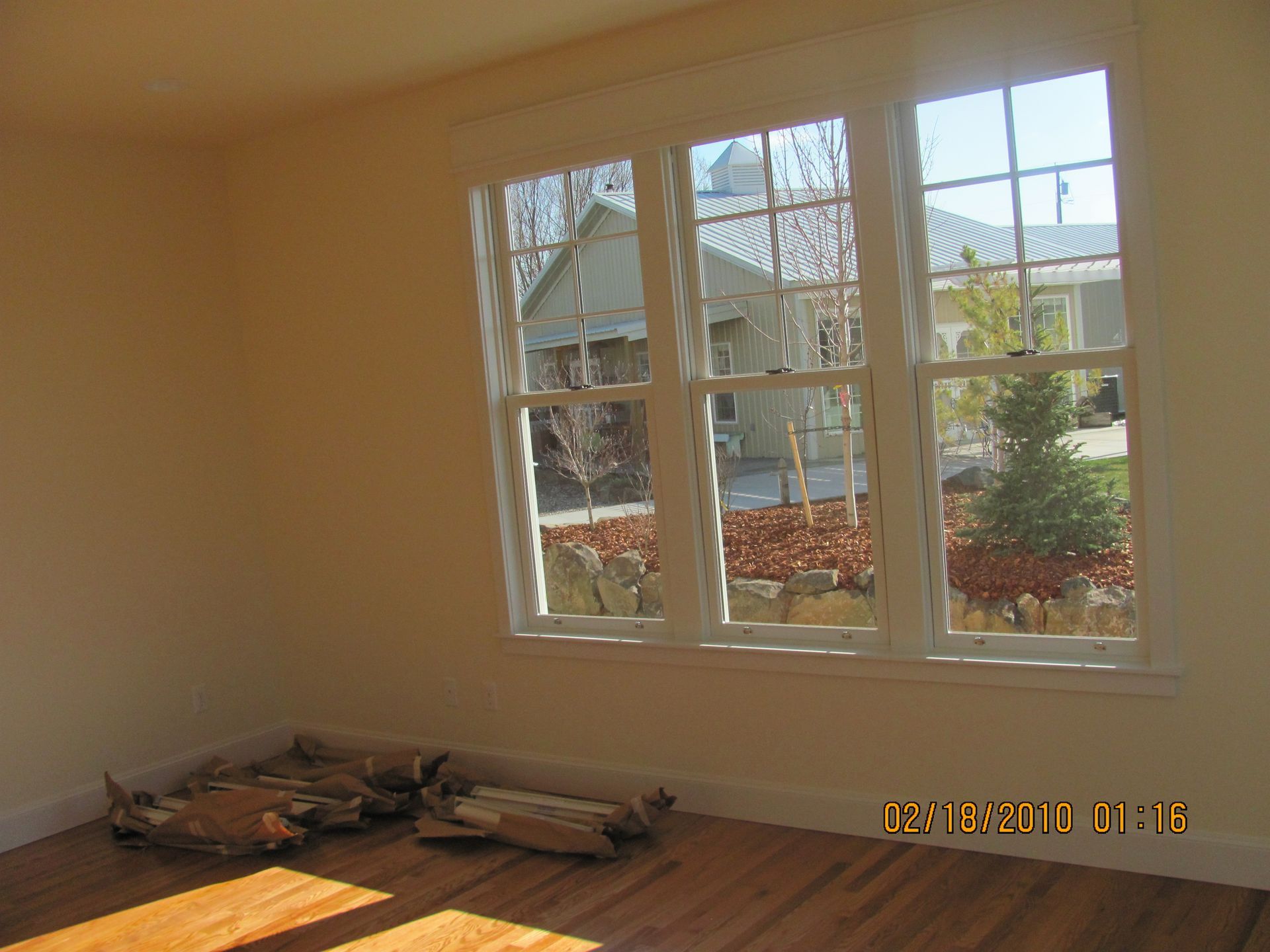 A room with a lot of windows and a picture taken on august 8 2013