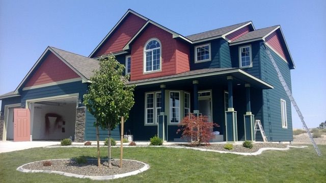 A large house with a blue and red exterior