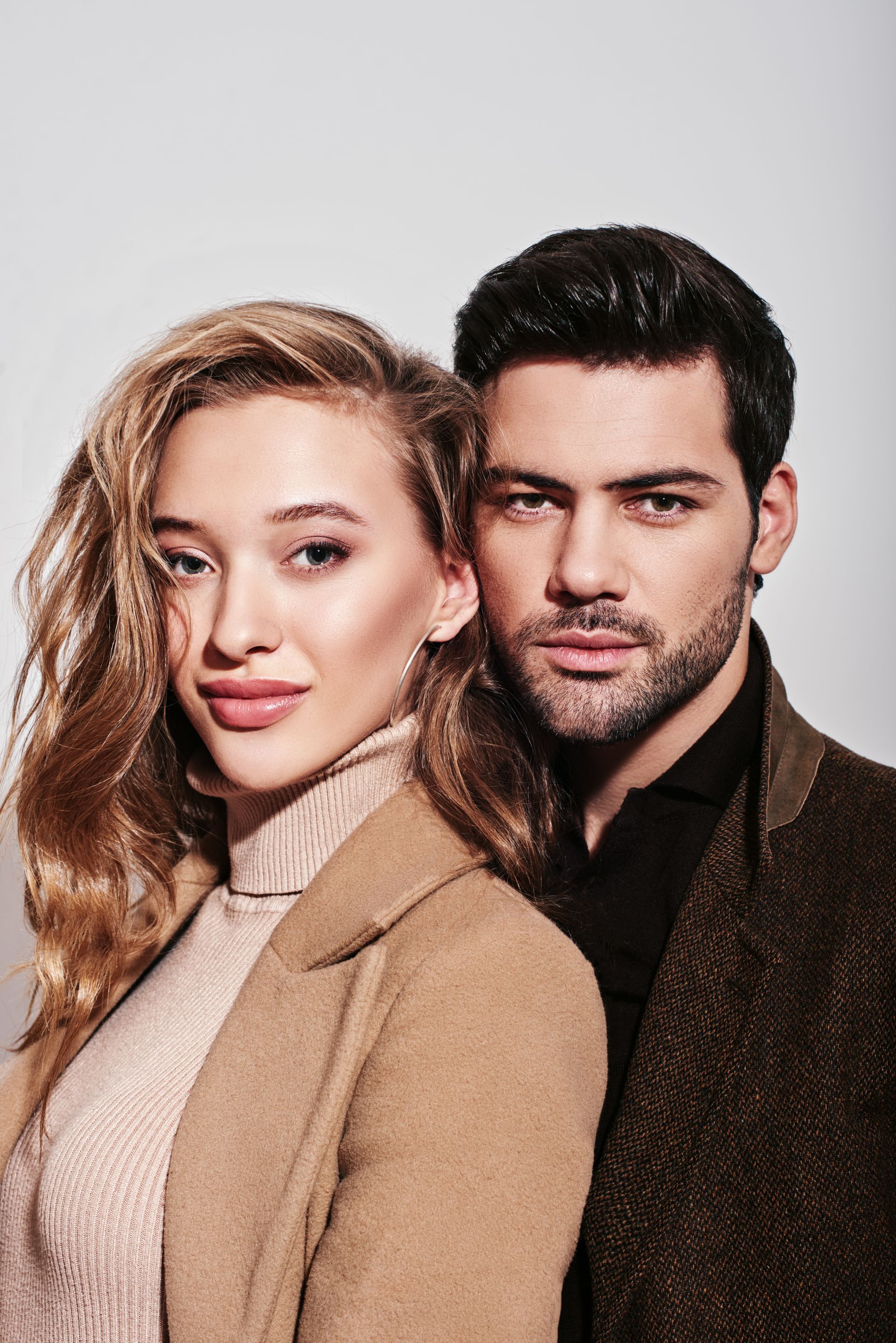 A man and a woman are posing for a picture together.