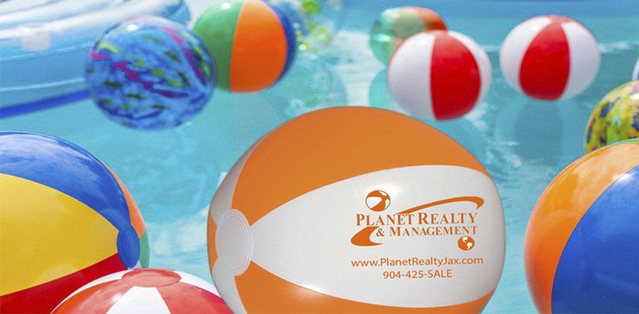 Planet Realty Management Blow up Balls in pool