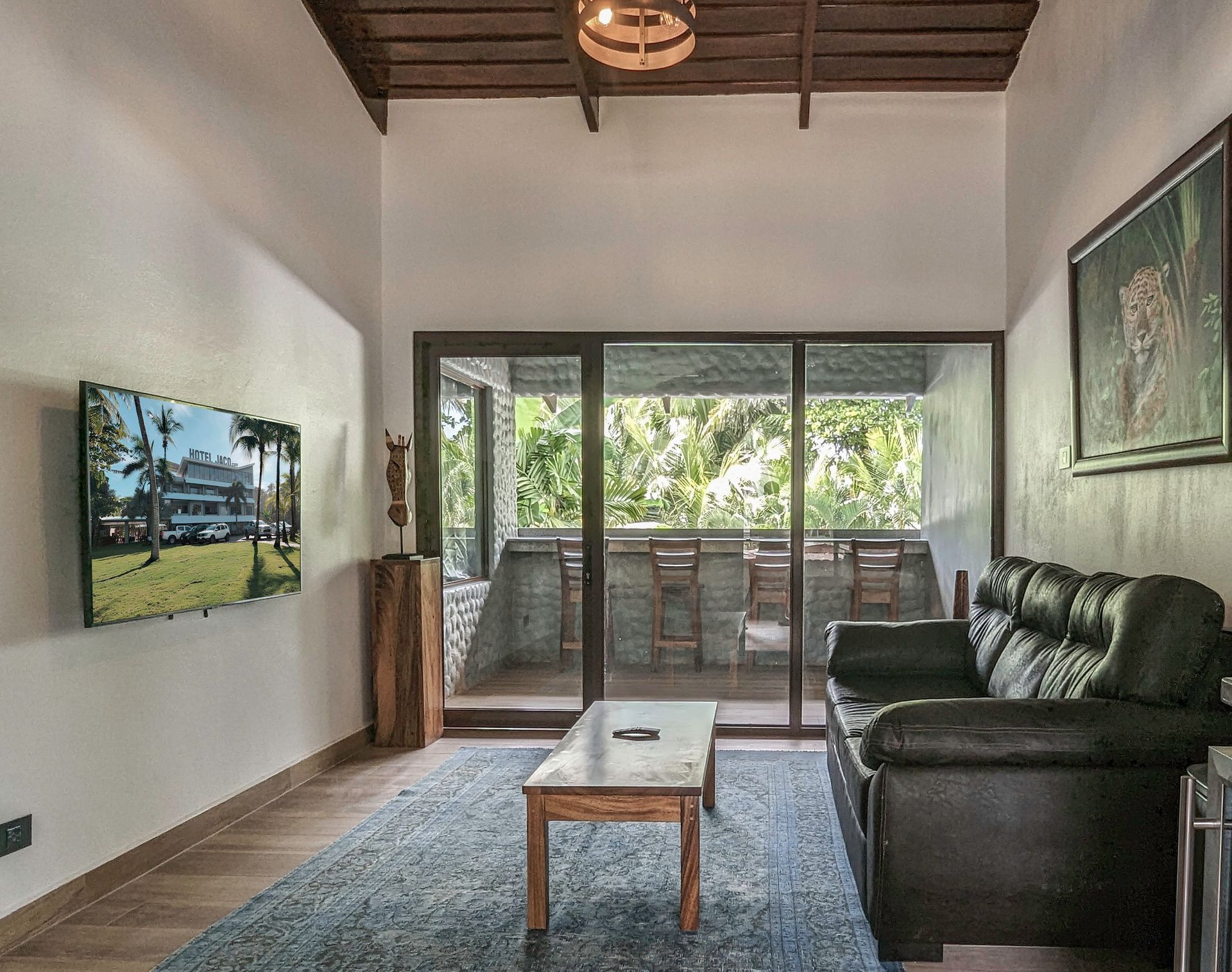 A living room with a couch , table , and television.